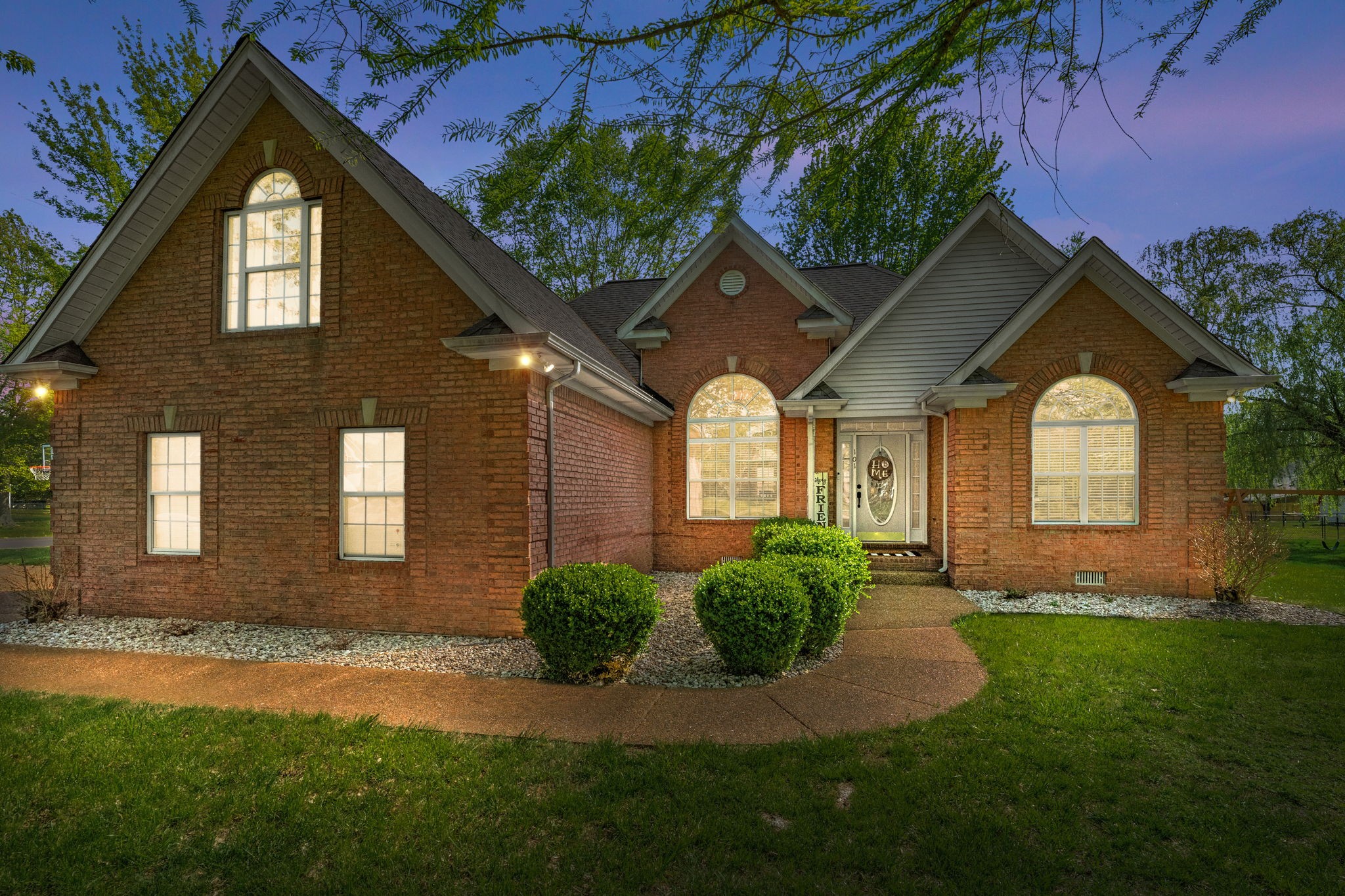 a front view of a house with a yard