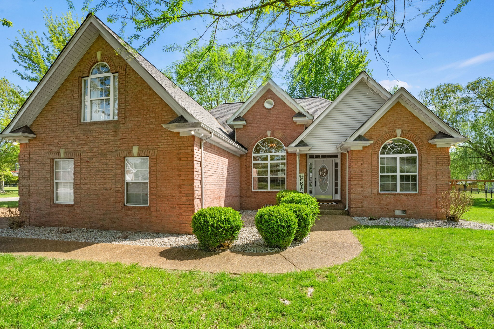 101 Lorelle Circle Portland, TN 37148 - Photo 2 of 21 a front view of a house with a yard and porch