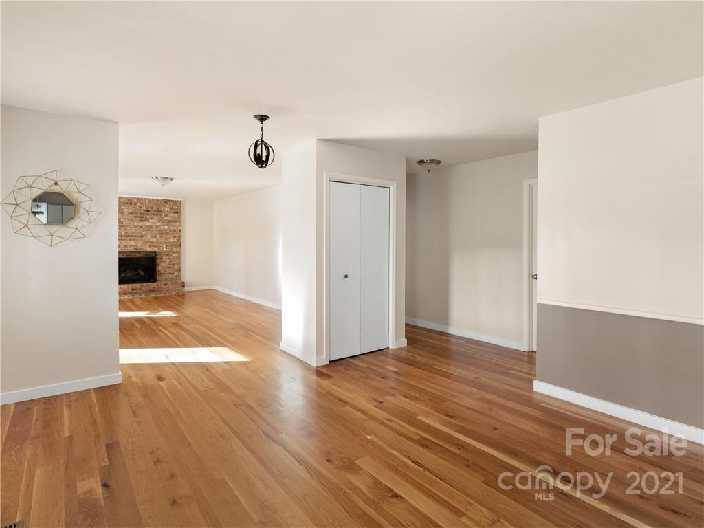 53 Westfield Road Fletcher, NC 28732 - Photo 14 of 24 a view of a big room with wooden floor and windows