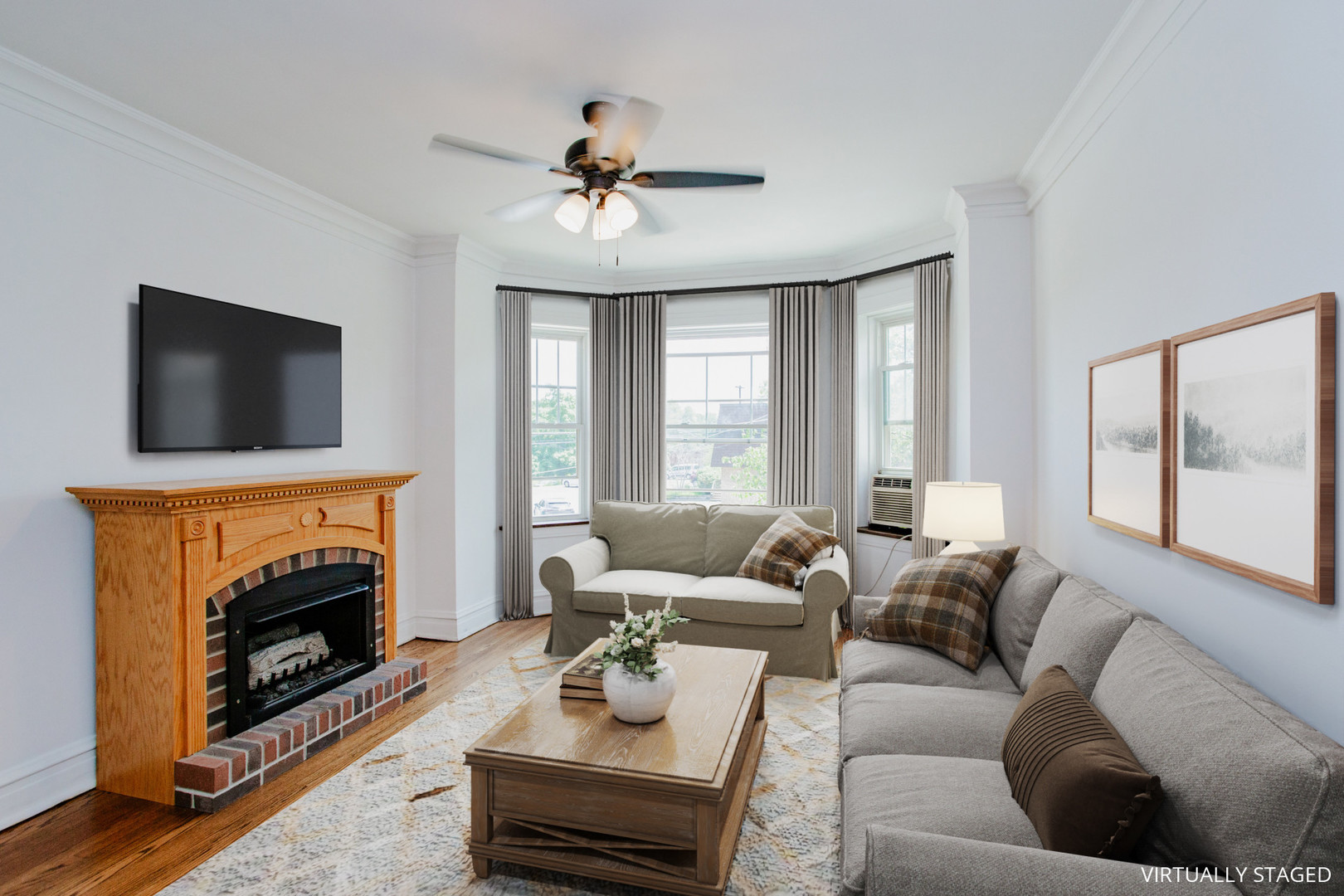 7639 Jackson Boulevard, Unit 1E Forest Park, IL 60130 - Photo 2 of 13 a living room with furniture a flat screen tv and a fireplace
