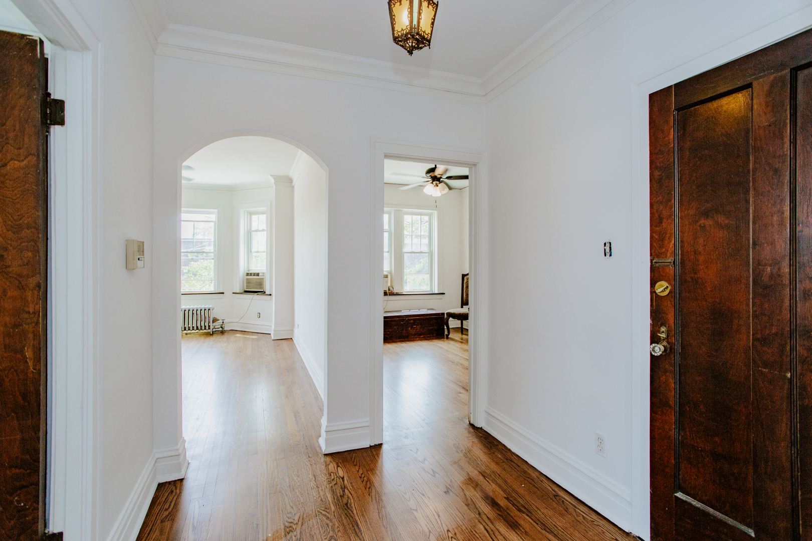 7639 Jackson Boulevard, Unit 1E Forest Park, IL 60130 - Photo 8 of 13 a view of a hallway with wooden floor windows and livingroom