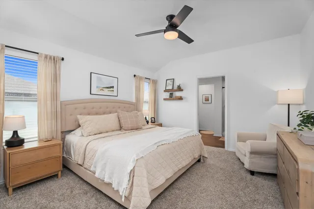 a bedroom with bed and window