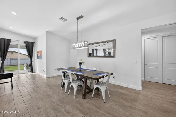 a view of a dining room with furniture window and wooden floor