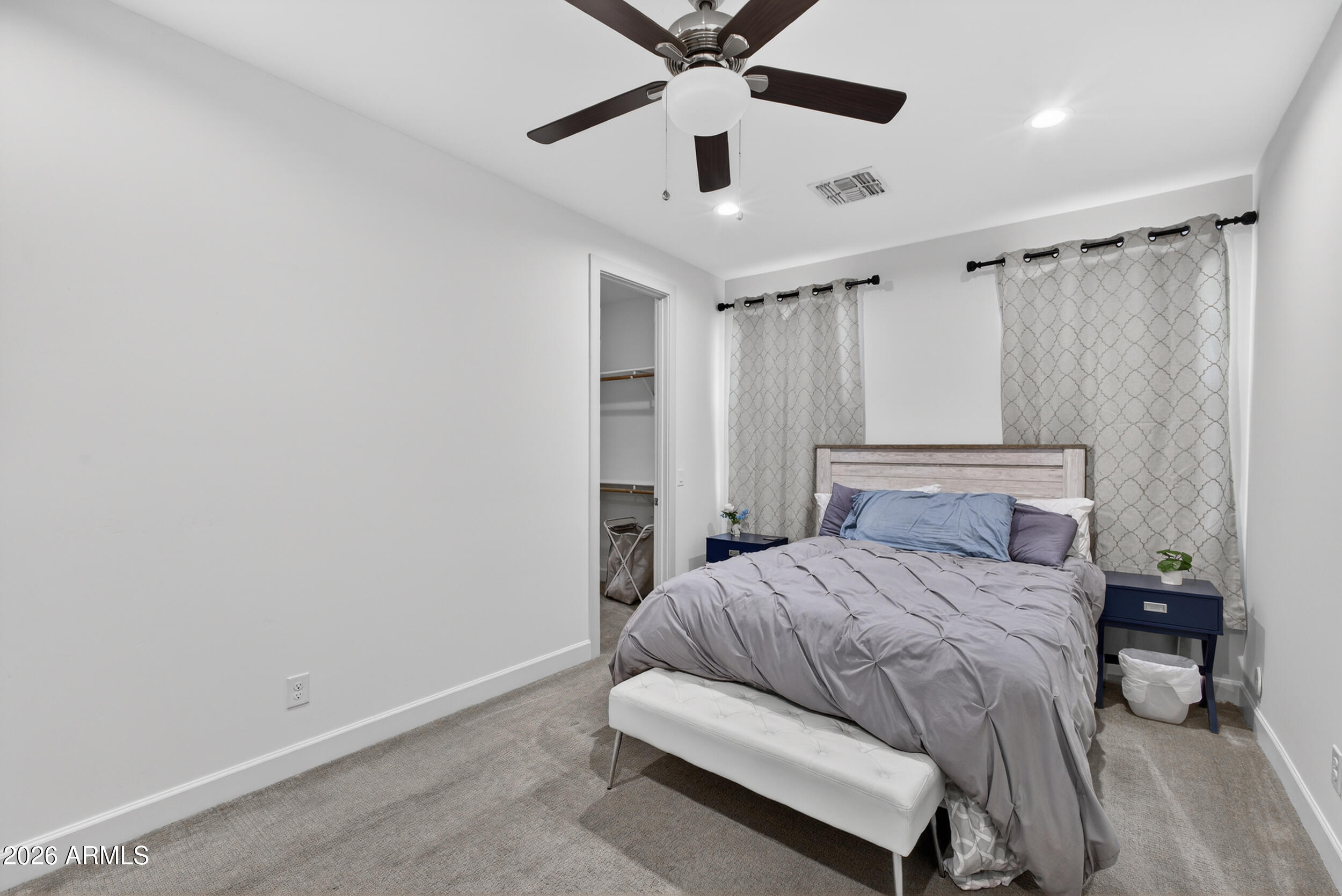 8942 North 15th Lane Phoenix, AZ 85021 - Photo 25 of 39 a bedroom with a bed and a chandelier