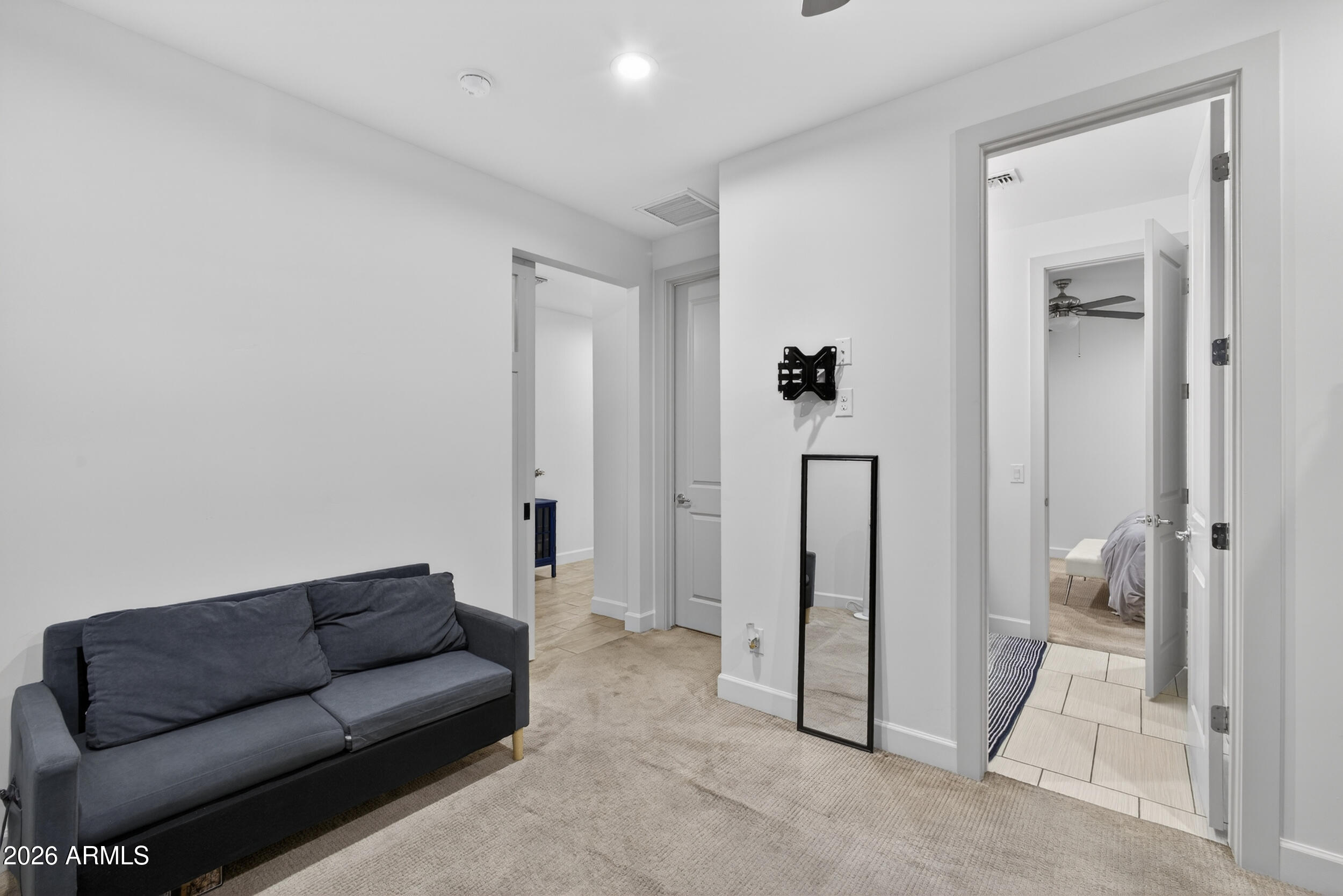 8942 North 15th Lane Phoenix, AZ 85021 - Photo 31 of 39 a living room with furniture and a glass door