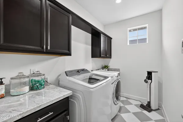 a kitchen with sink and cabinets
