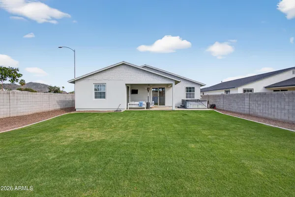 a view of a house with a backyard