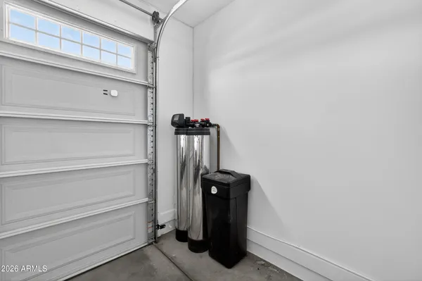 a view of storage and utility room with closet