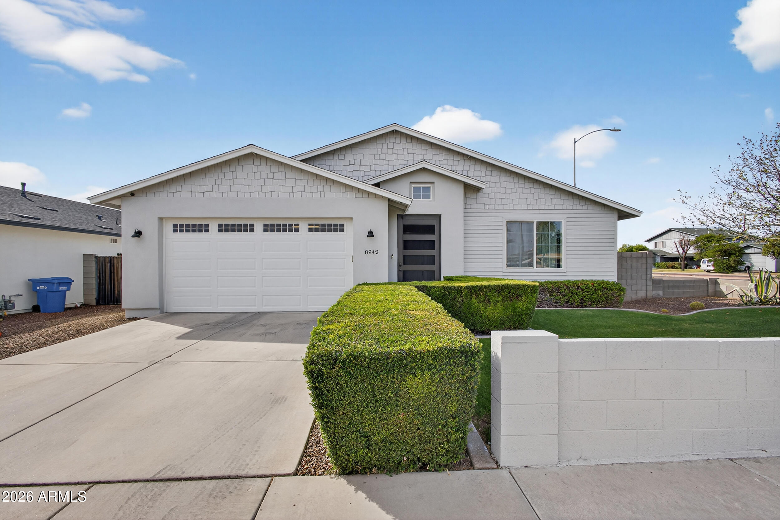 8942 North 15th Lane Phoenix, AZ 85021 - Photo 6 of 39 a view of a house with a yard and large tree