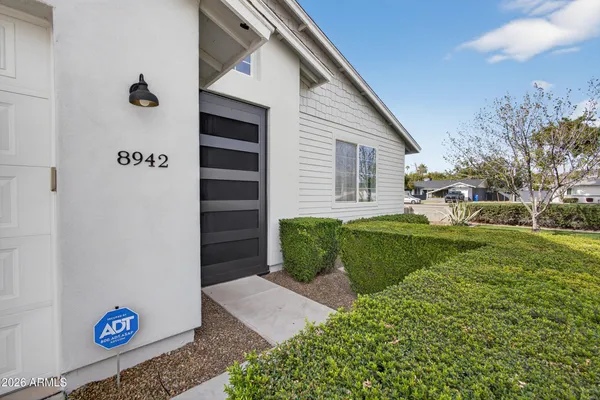 a view of a house with a back yard