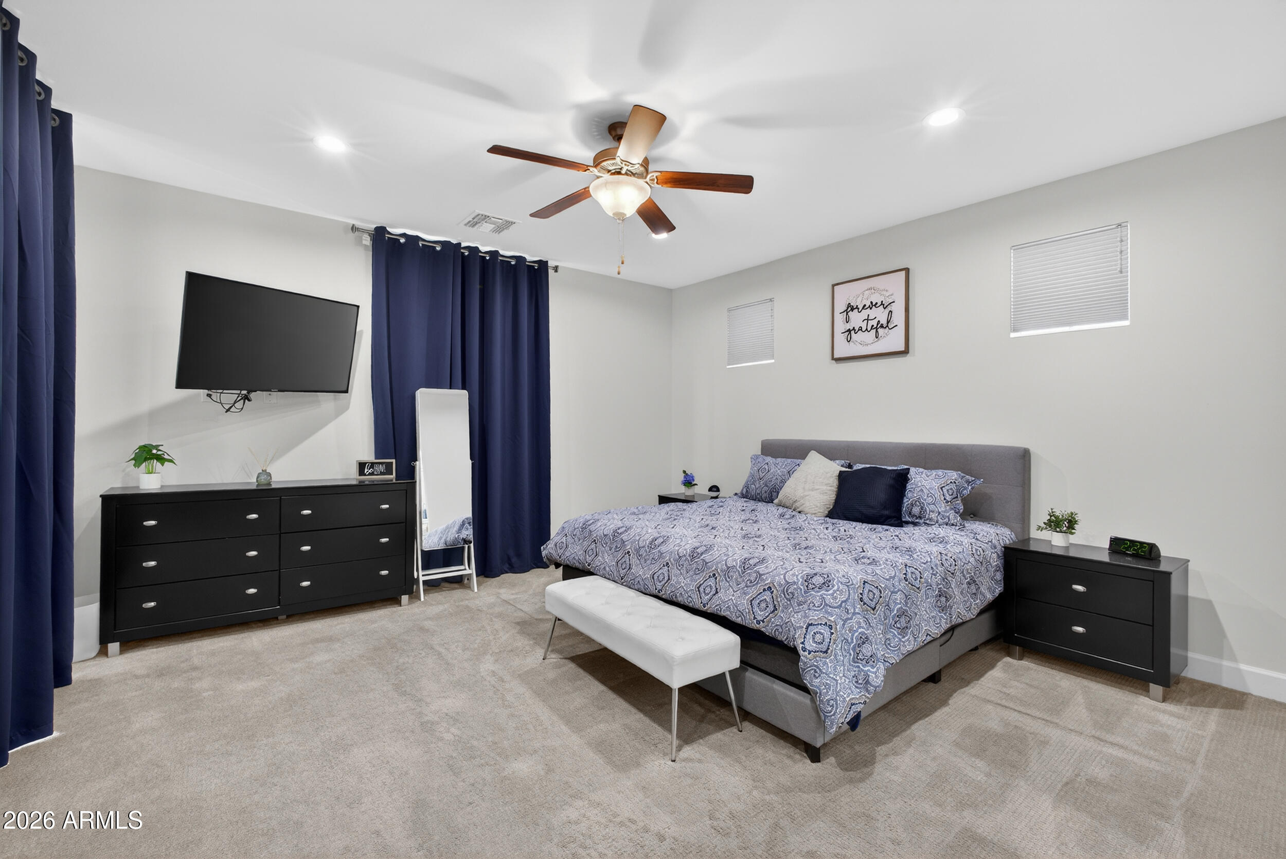 8942 North 15th Lane Phoenix, AZ 85021 - Photo 8 of 39 a bedroom with a bed and a flat screen tv