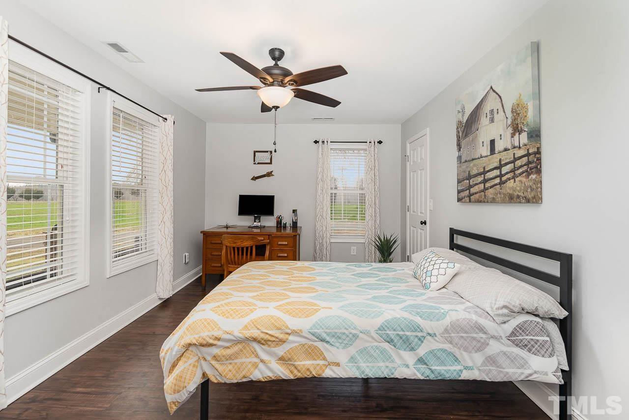 2369 Lonnie Gentry Road Roxboro, NC 27574 - Photo 12 of 24 a bedroom with a bed and a window