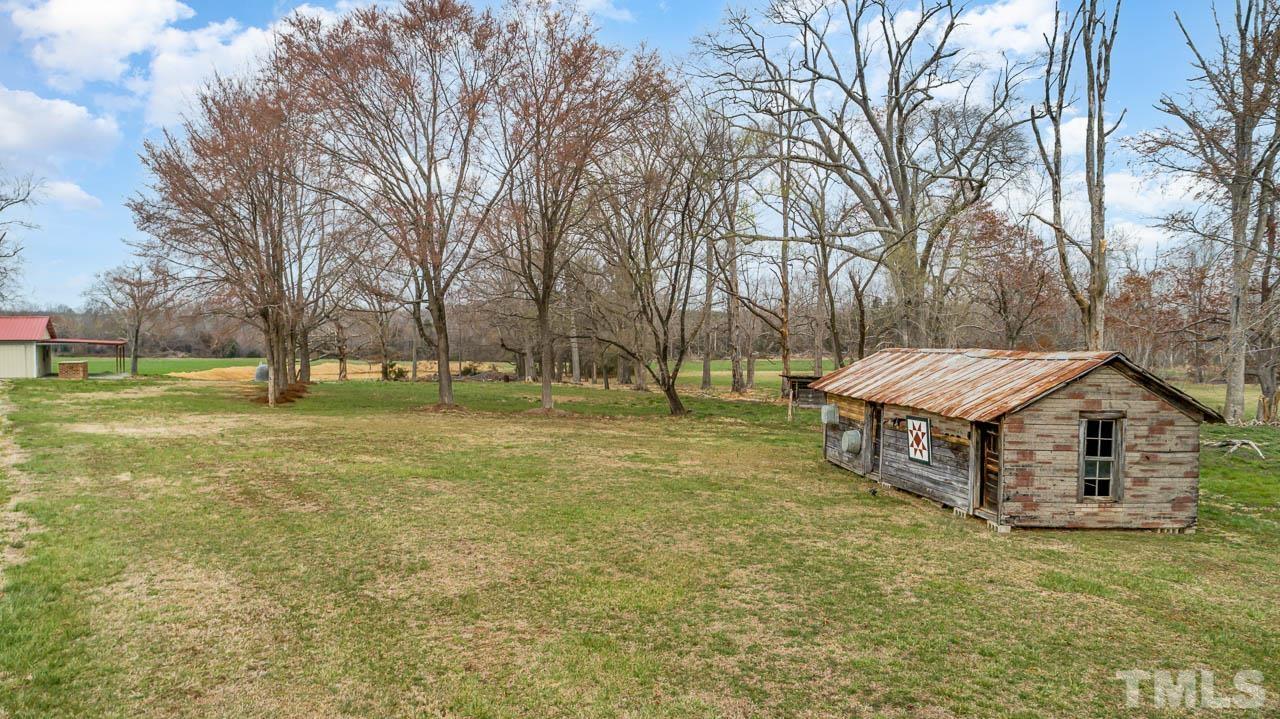 2369 Lonnie Gentry Road Roxboro, NC 27574 - Photo 22 of 24 a view of a house with a yard