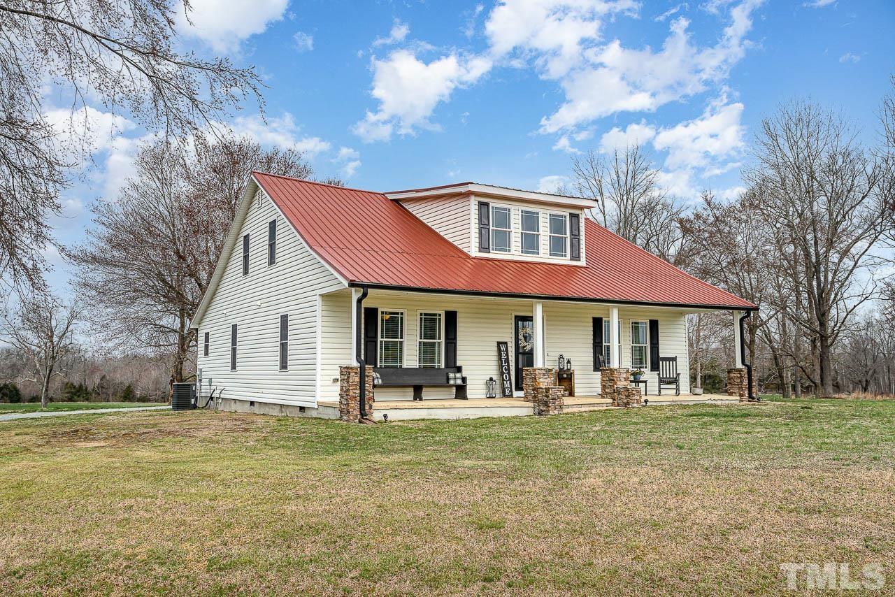 2369 Lonnie Gentry Road Roxboro, NC 27574 - Photo 23 of 24 a front view of a house with garden