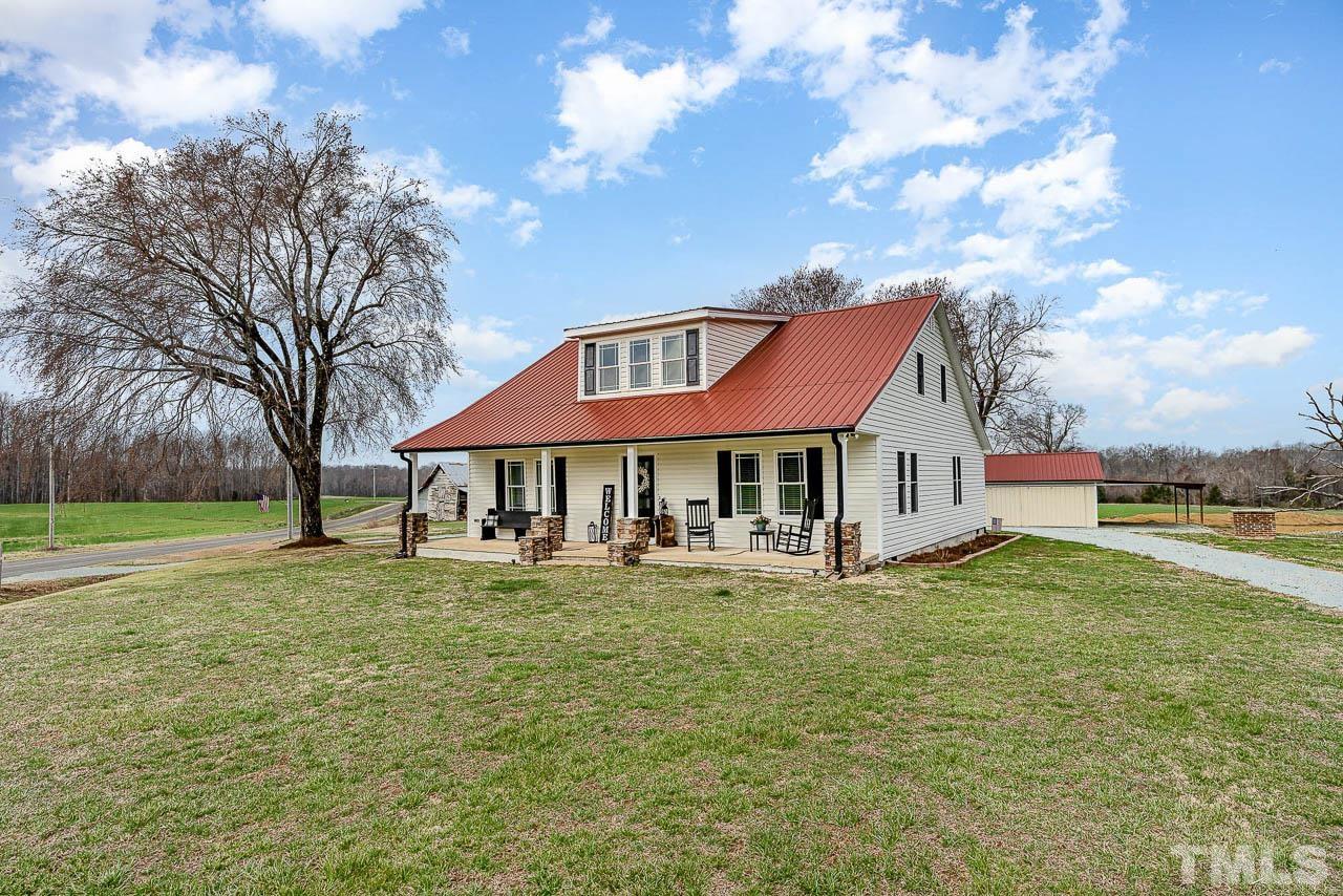 2369 Lonnie Gentry Road Roxboro, NC 27574 - Photo 24 of 24 a view of a house with a yard
