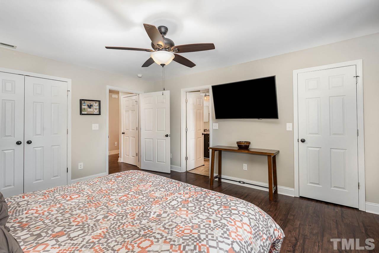 2369 Lonnie Gentry Road Roxboro, NC 27574 - Photo 10 of 24 a bedroom with a bed and a flat screen tv