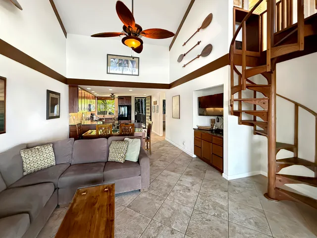 a living room with furniture and flat screen tv