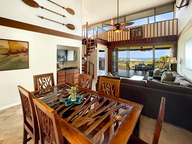 a view of a dining room with furniture wooden floor and chandelier
