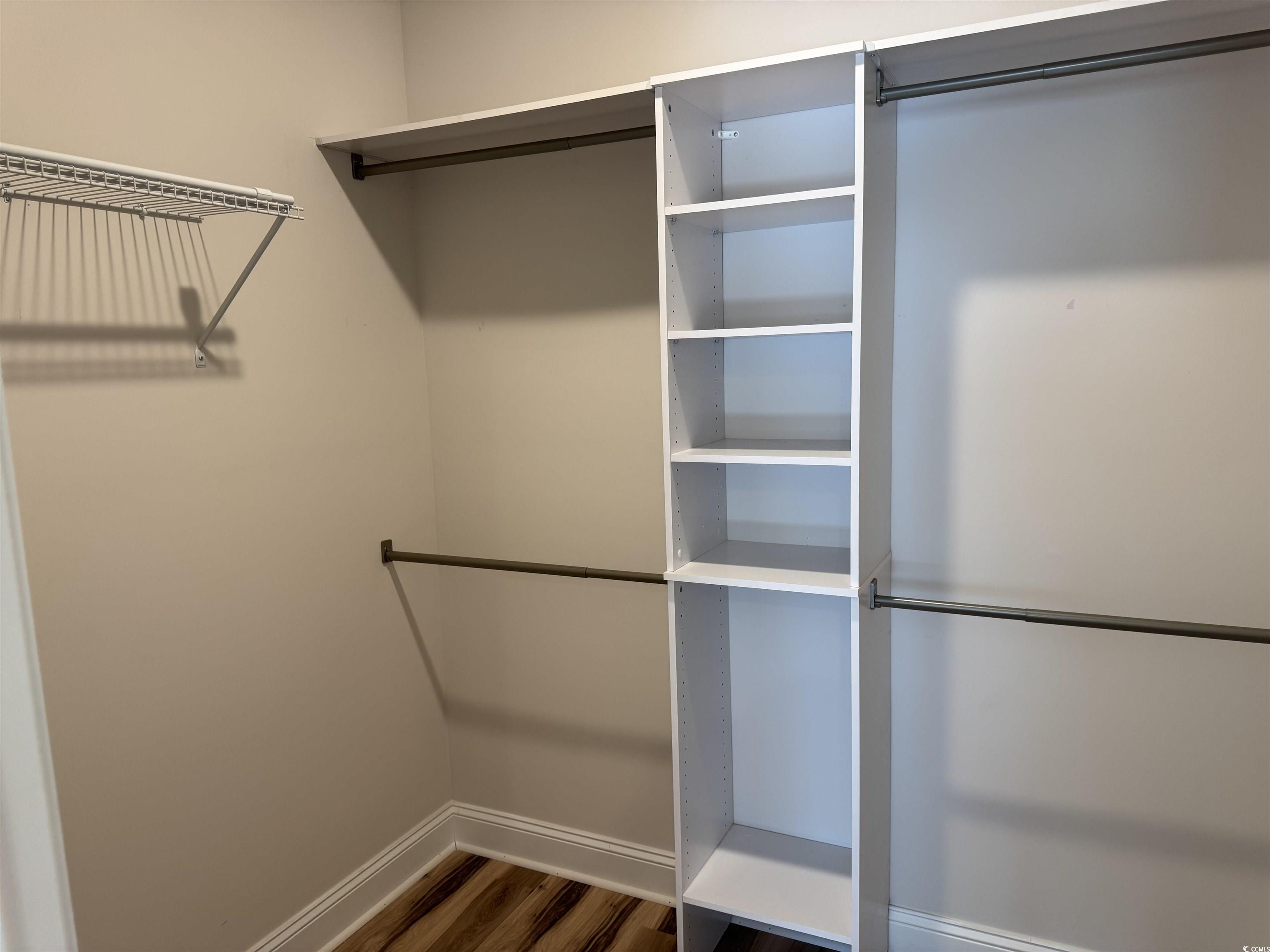 405 St John Road Galivants Ferry, SC 29544 - Photo 16 of 16 Spacious closet featuring dark wood-style floors
