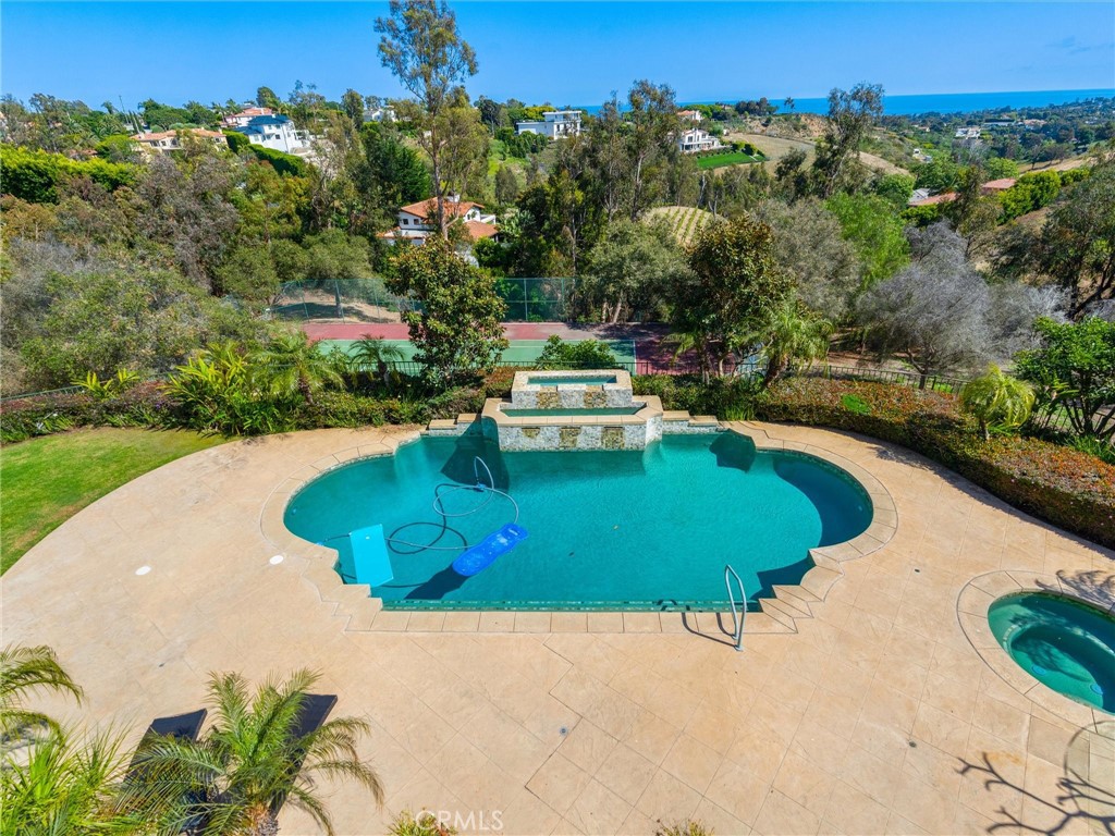 6000 Cavalleri Road Malibu, CA 90265 - Photo 10 of 44 a view of a swimming pool with a yard and large trees