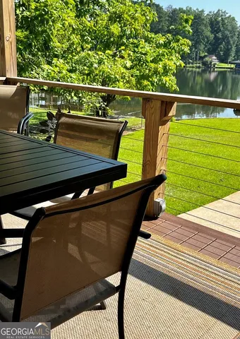 a view of sitting area and swimming pool