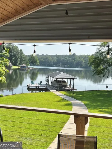 a view of a swimming pool with a lake view