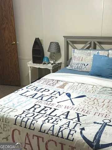 a view of a bedroom with a bed