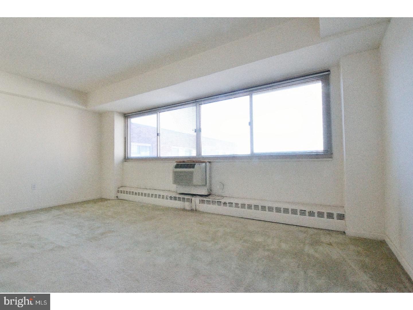 view of an empty room with a window