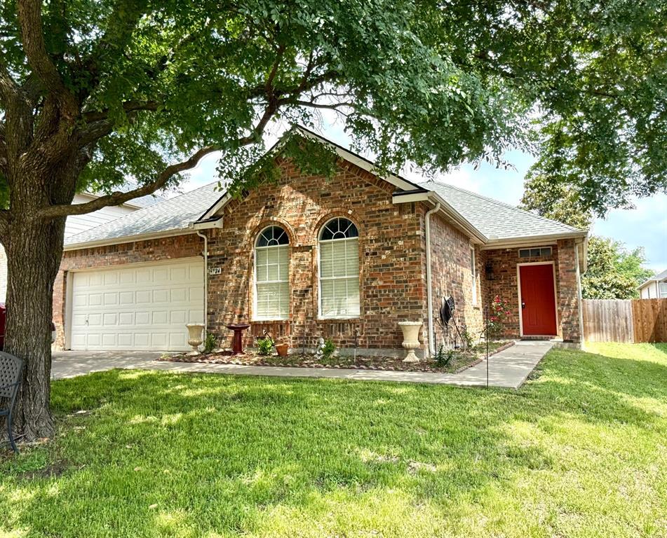 a front view of a house with yard
