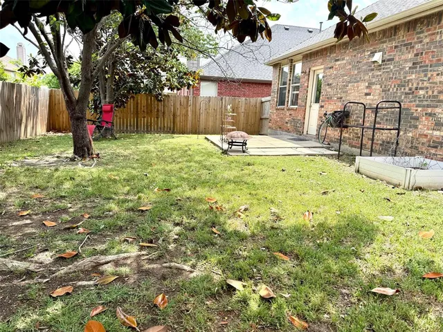 a swimming pool with outdoor seating and yard