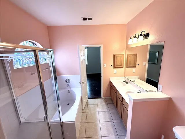 a bathroom with a sink a mirror and a toilet