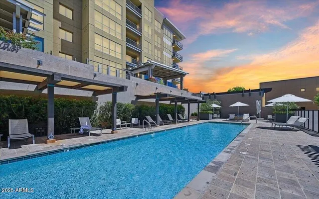 a view of a building with a yard