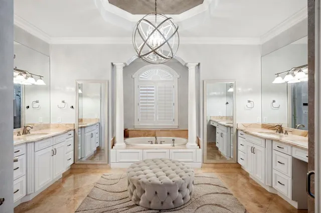 a large bathroom with a sink a large mirror and a shower