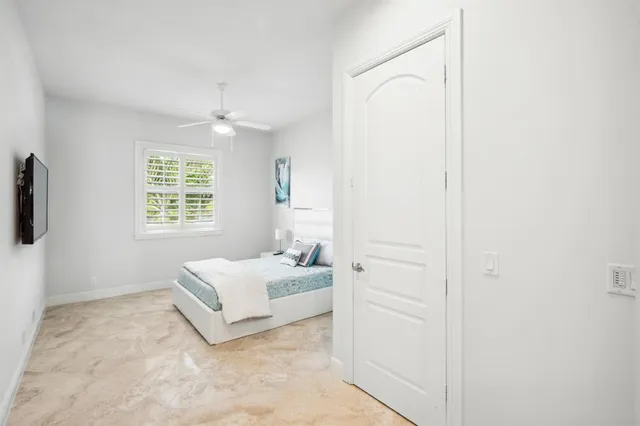 a view of a storage and utility room with washing machine