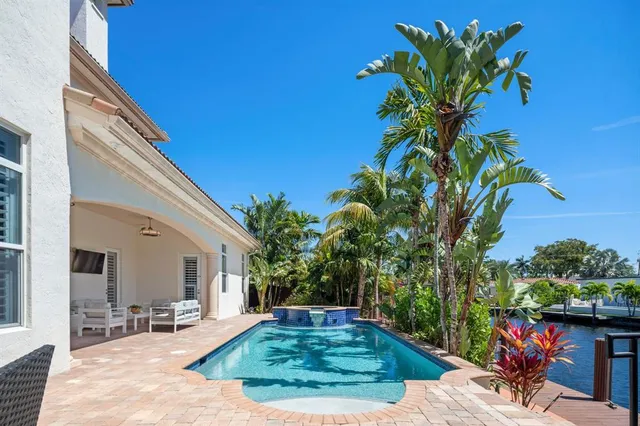 a view of balcony with furniture and garden
