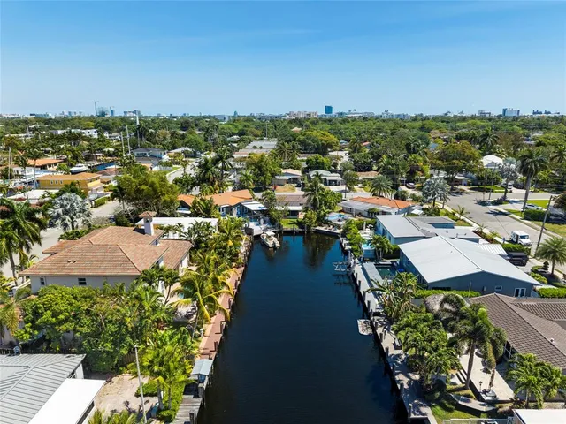a view of multiple houses with a street