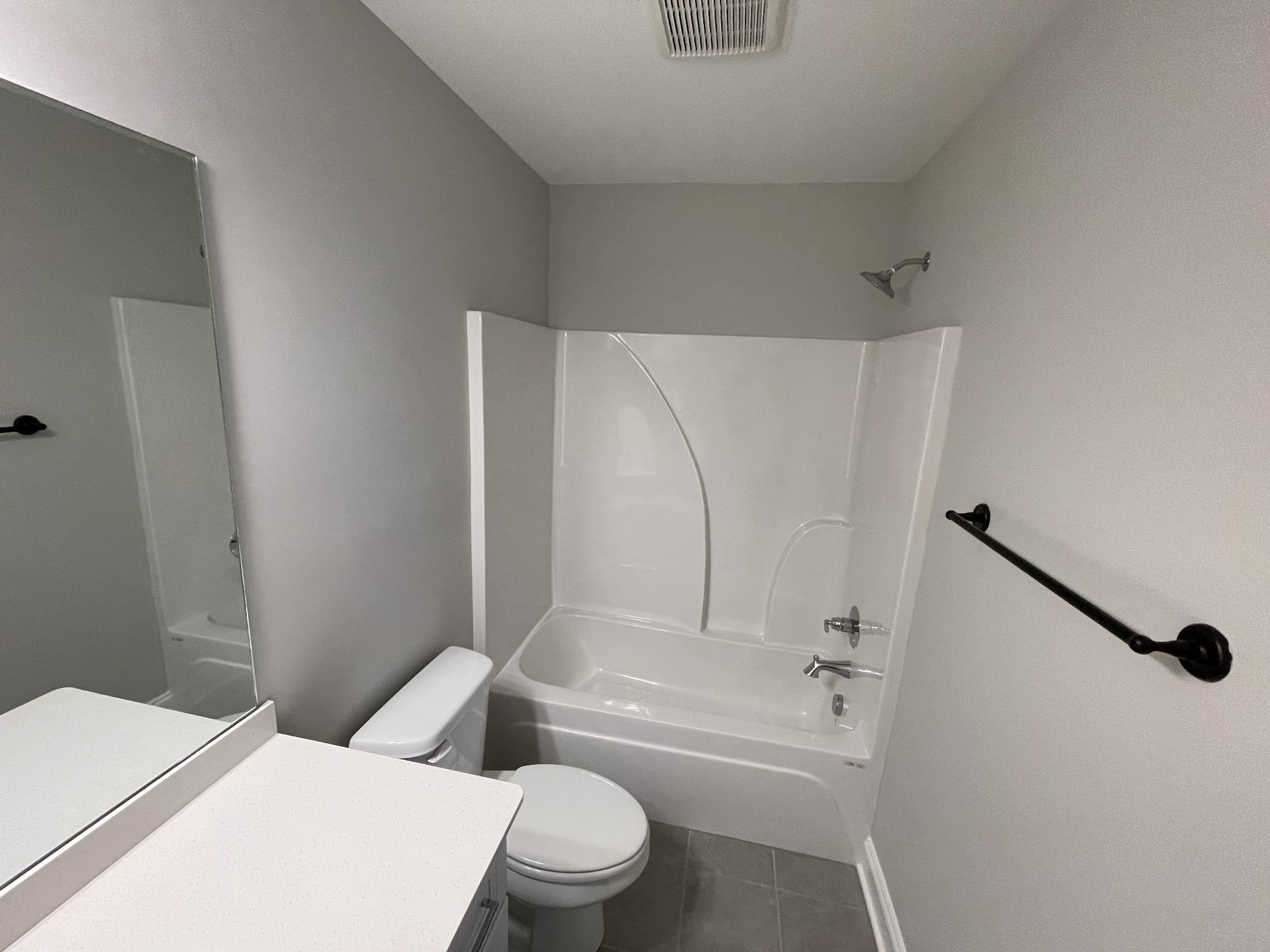 1154 June Wilde Ridge Spring Hill, TN 37174 - Photo 25 of 37 a white toilet sitting next to a bath tub