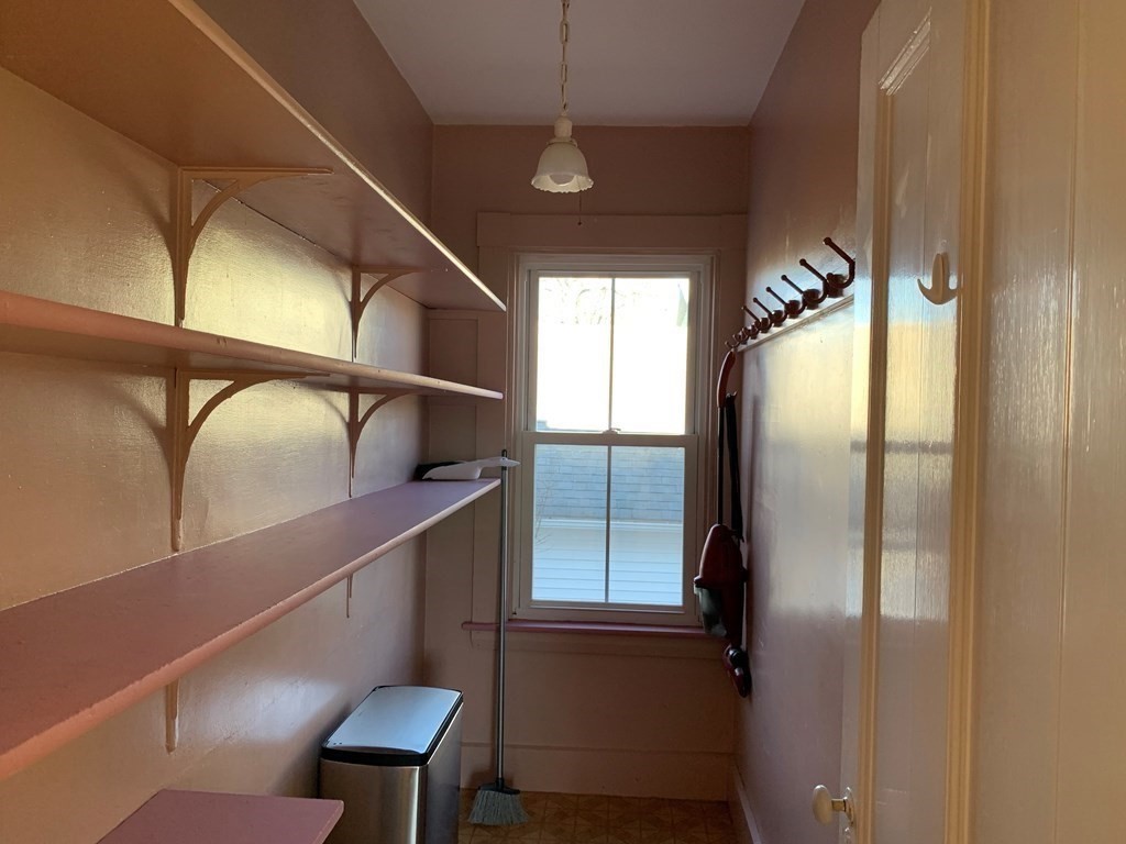 5 Plain Street Natick, MA 01760 - Photo 14 of 31 a kitchen with cabinets and a refrigerator