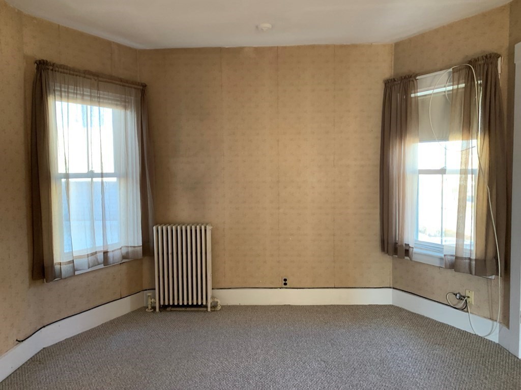 5 Plain Street Natick, MA 01760 - Photo 16 of 31 an empty room with windows