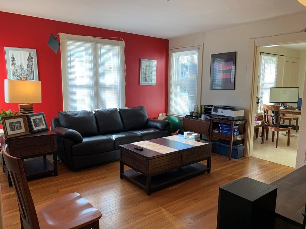 5 Plain Street Natick, MA 01760 - Photo 19 of 31 a living room with furniture and wooden floor