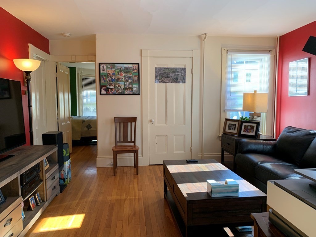 5 Plain Street Natick, MA 01760 - Photo 21 of 31 a living room with furniture and a flat screen tv