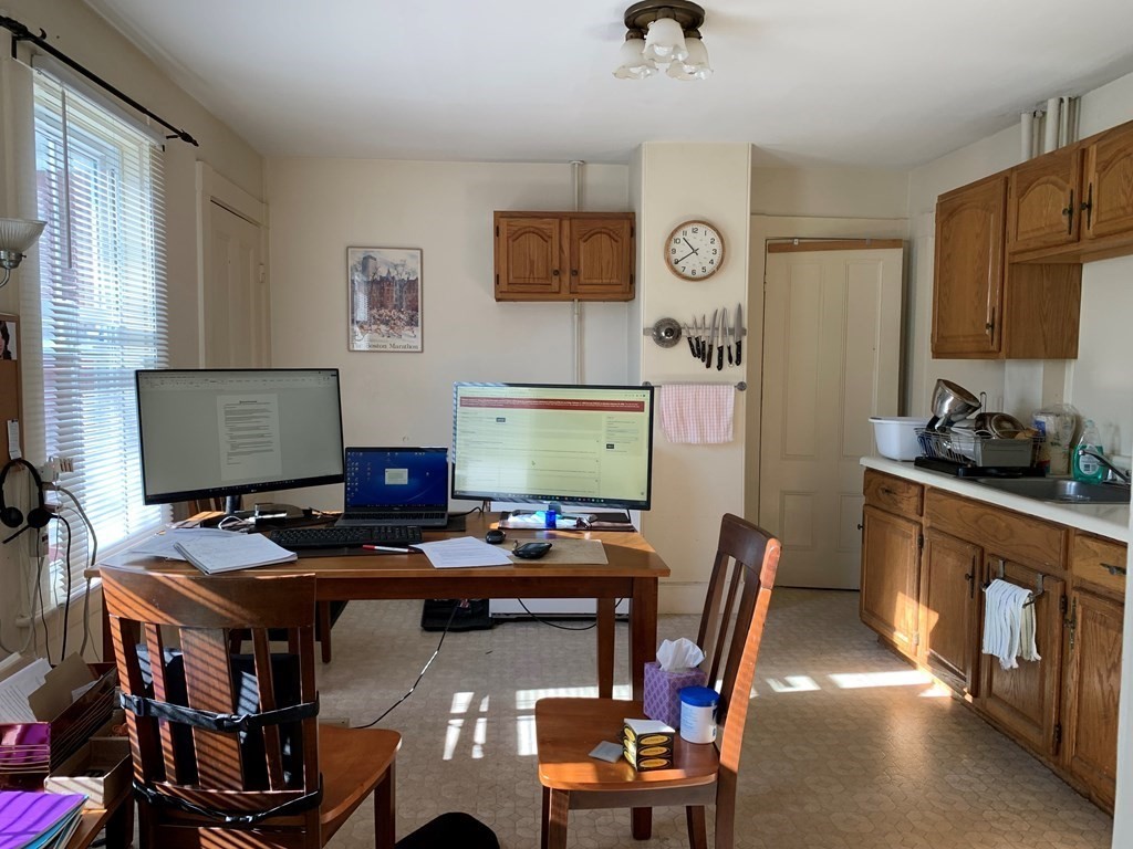 5 Plain Street Natick, MA 01760 - Photo 23 of 31 a work room with furniture and musical instruments