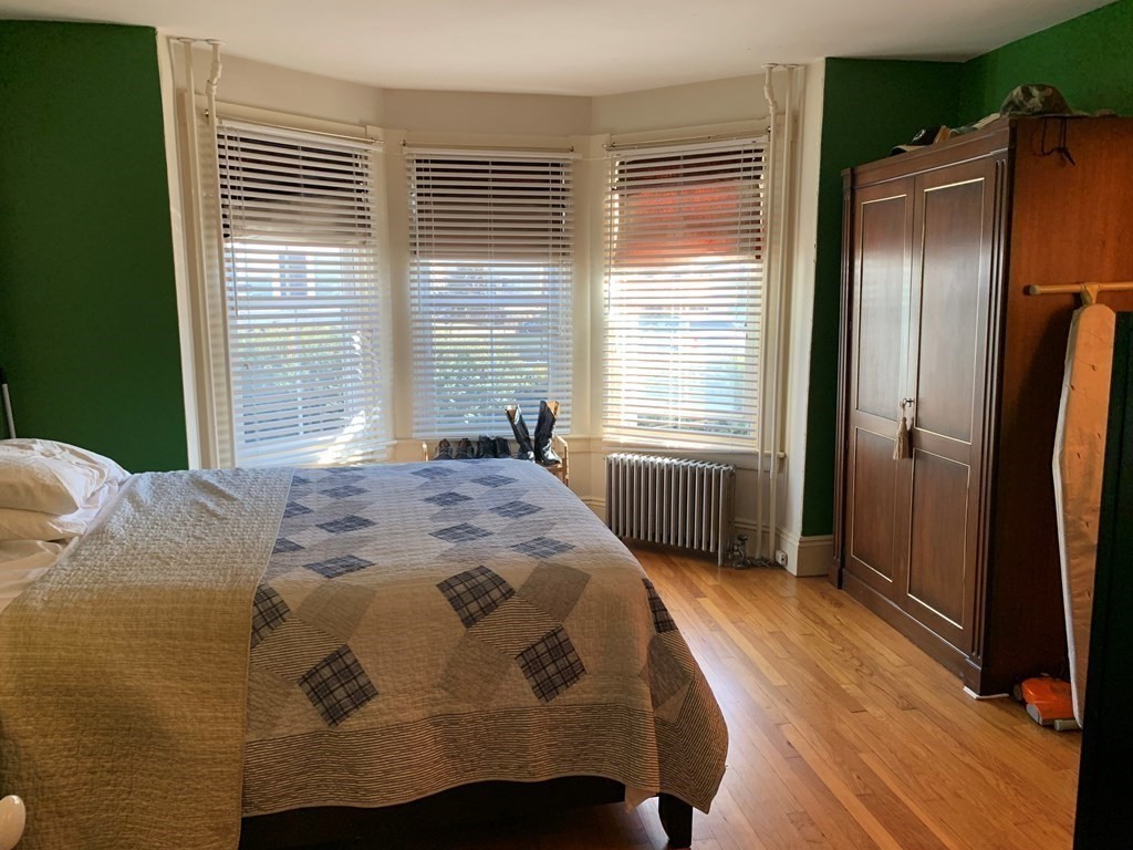 5 Plain Street Natick, MA 01760 - Photo 25 of 31 a bedroom with a bed and a window