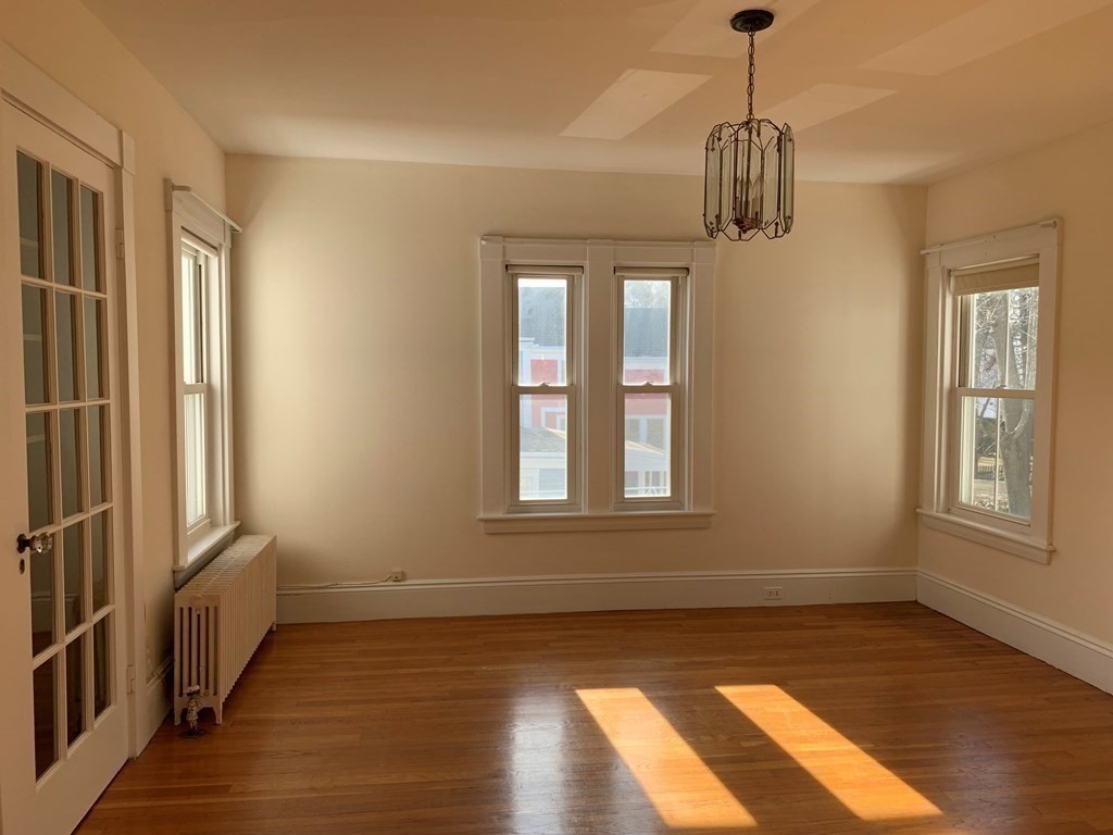 5 Plain Street Natick, MA 01760 - Photo 8 of 31 a view of empty room with wooden floor and fan