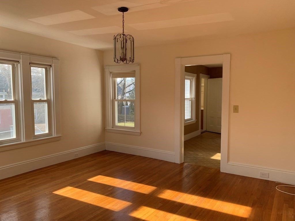 5 Plain Street Natick, MA 01760 - Photo 10 of 31 a view of empty room with wooden floor and fan