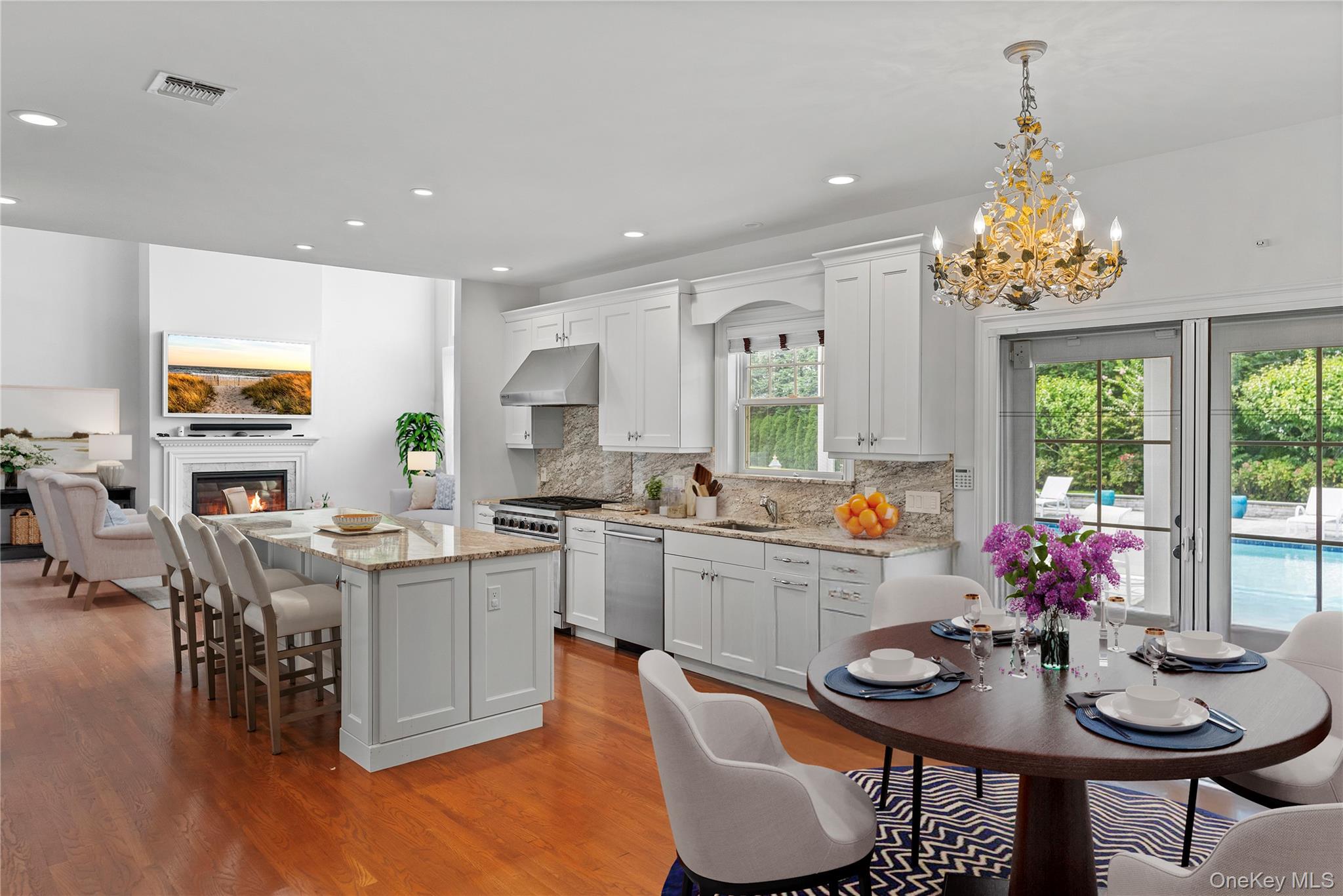 4 Spring Lane Southampton, NY 11968 - Photo 14 of 39 a kitchen with a dining table chairs and kitchen