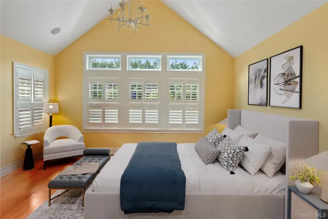 a bedroom with a bed and glass window