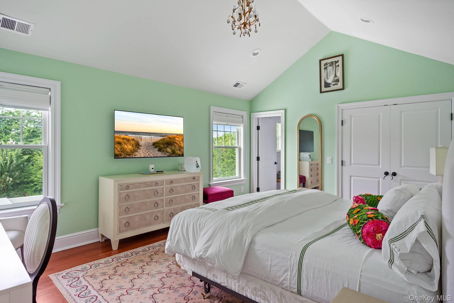 4 Spring Lane Southampton, NY 11968 - Photo 20 of 39 a bedroom with a bed and a flat screen tv