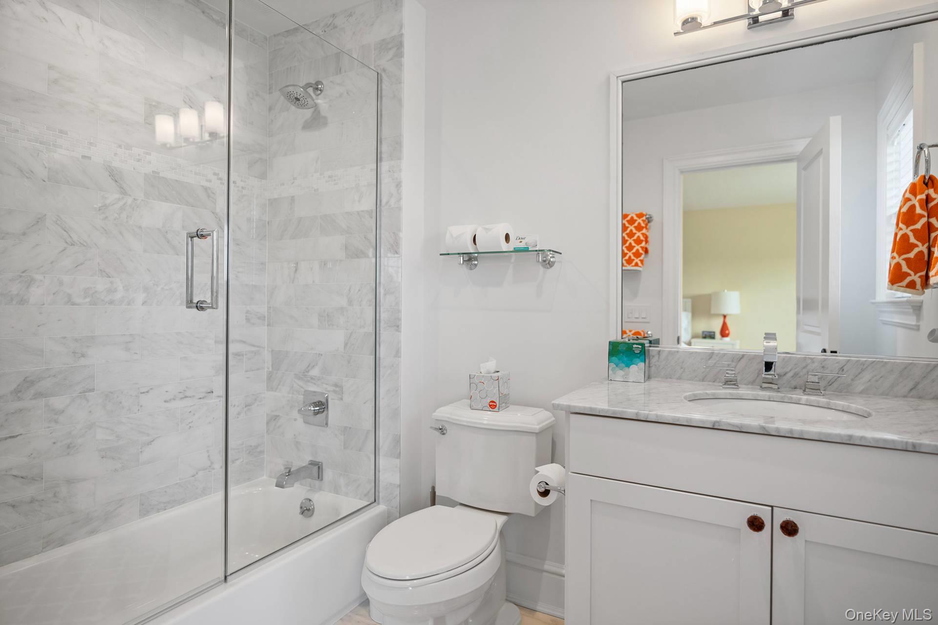 4 Spring Lane Southampton, NY 11968 - Photo 21 of 39 a bathroom with a sink toilet vanity and shower