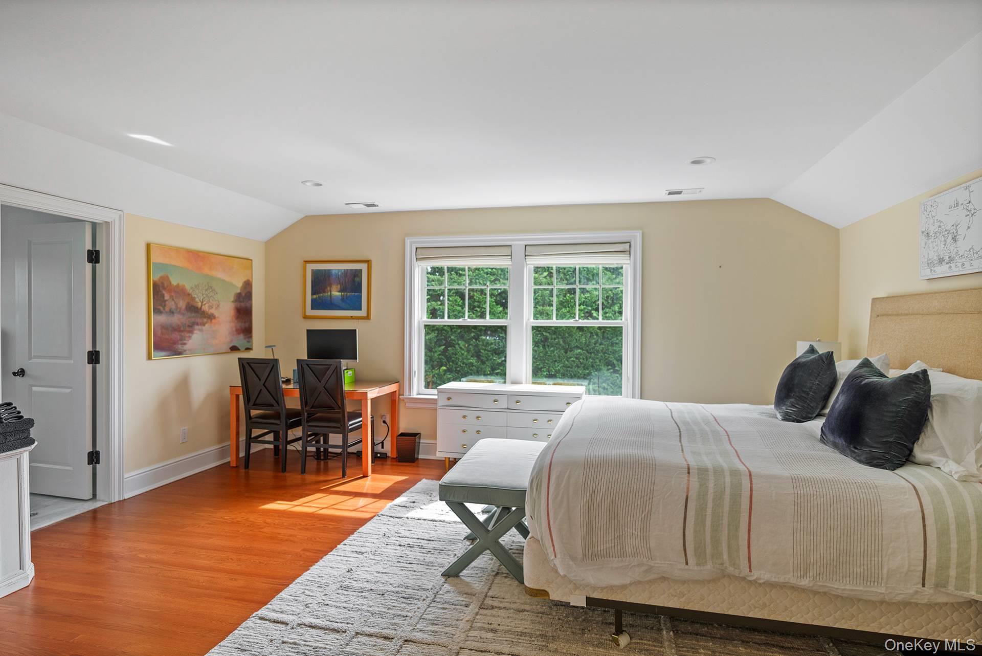 4 Spring Lane Southampton, NY 11968 - Photo 22 of 39 a bedroom with a bed and wooden floor